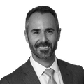 Headshot of Dan Baer in black and white