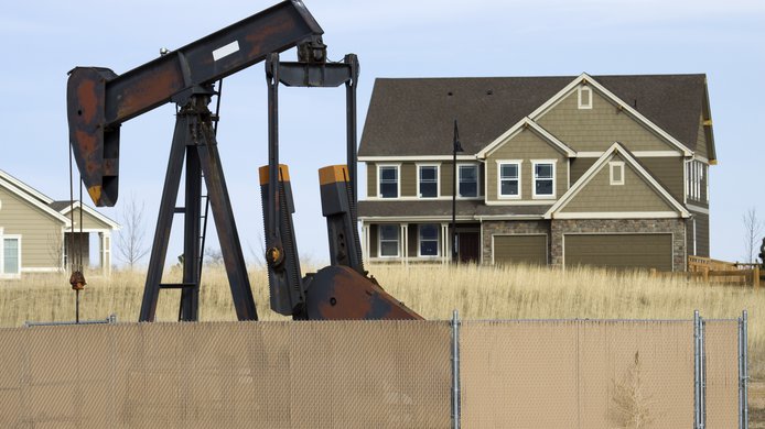 Pump jack / oil rig near house