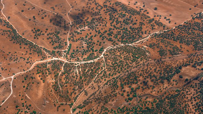 Abstract aerial landscape with dusty roads like rivers