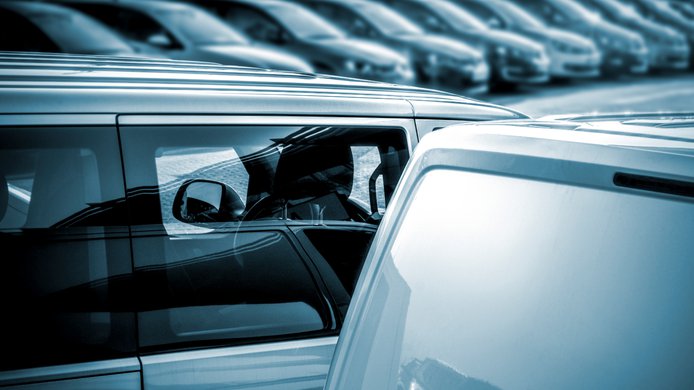 New cars in the dealership in a row