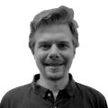 A black-and-white headshot of Daniel Mork