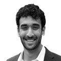 A black-and-white headshot of Ishan Sharma