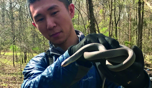 Ya-Wei (Jake) Li with snake