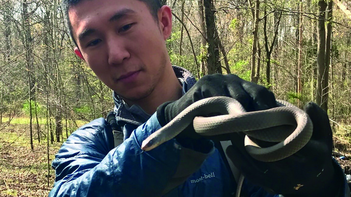 Ya-Wei (Jake) Li with snake