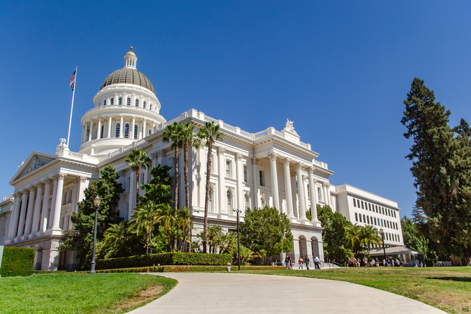 The California State Capitol building in Sacramento on a sunny day.