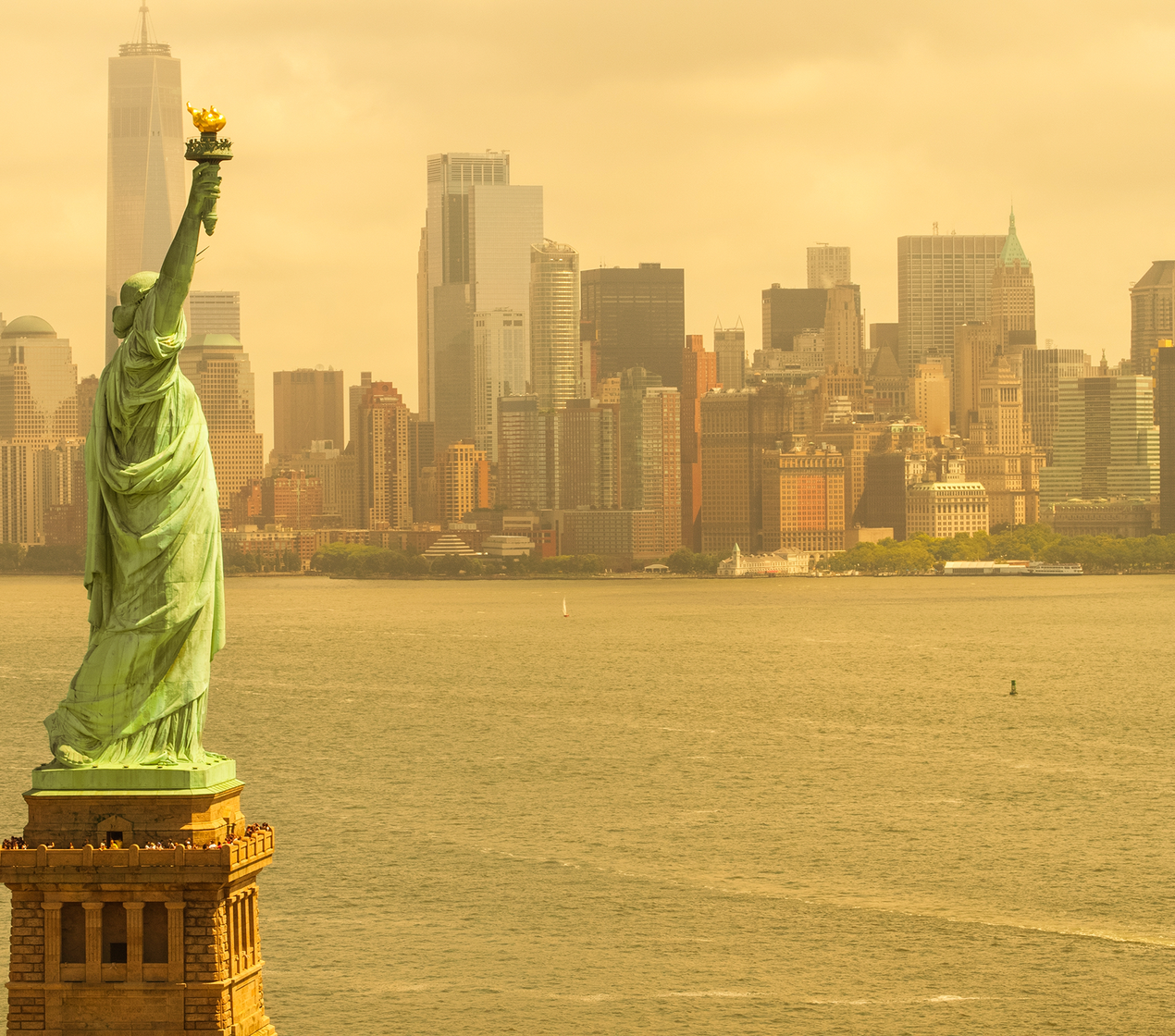 New York Statue of Liberty overlooking New York City covered in a thick smog.