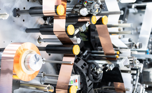 A close-up of machinery in a lithium battery production line