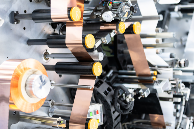 A close-up of machinery in a lithium battery production line