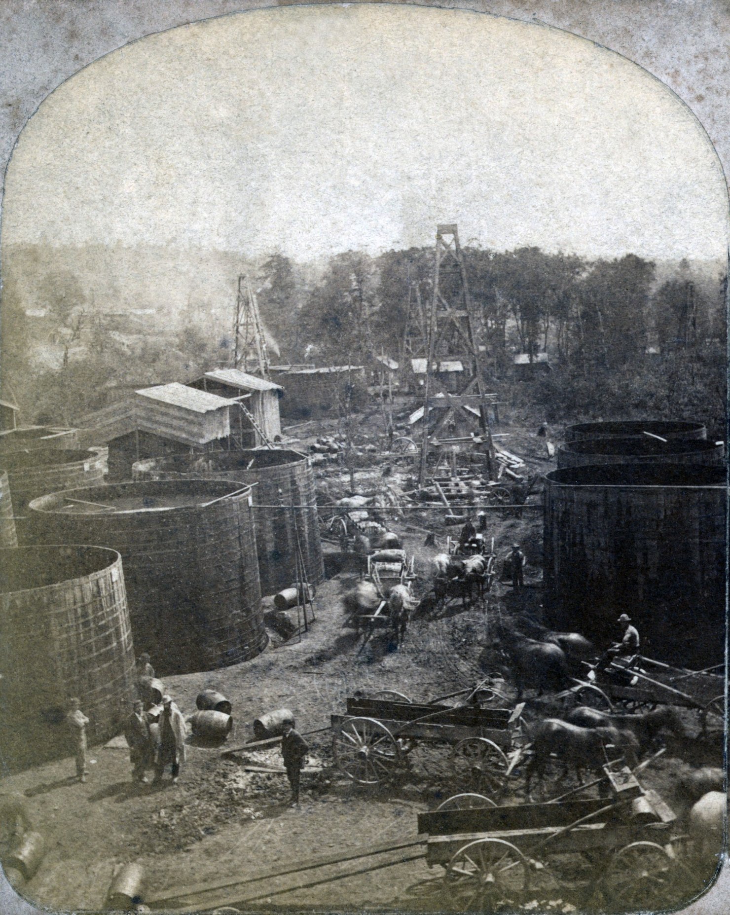 Chaotic nature of the Oil Region’s historic boom in the 1860s, with oil storage tanks, operating wells, horse-pulled carriages, and oil barrels strewn haphazardly across the city of Pithole.
