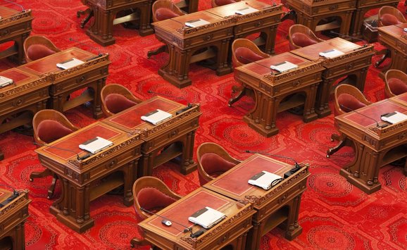 Close up of chairs in the State Senate room within the California state capitol building in Sacramento.