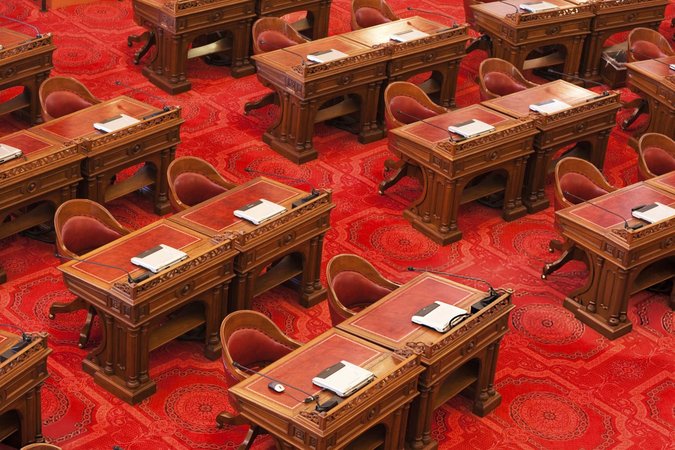 Close up of chairs in the State Senate room within the California state capitol building in Sacramento.