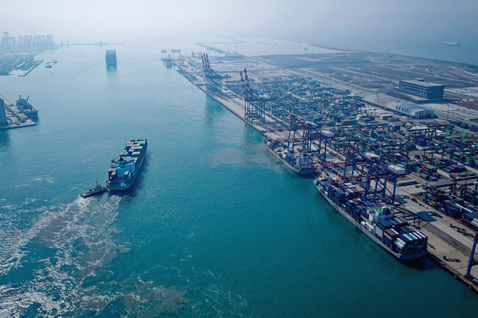 Cargo ships pull up to a port in New Taipei City, Taiwan
