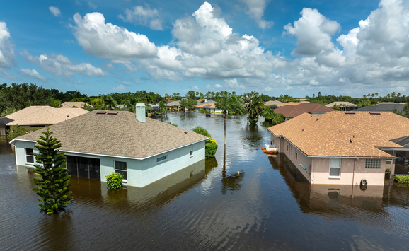 A group of homes in a flooded street in Florida after a storm.
