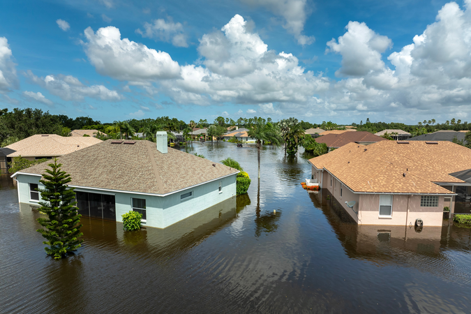 A group of homes in a flooded street in Florida after a storm.