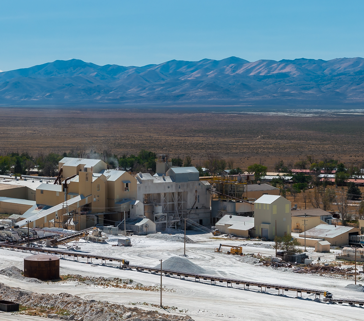 A view of the Bonneville Salt Flats, Utah, with mining equipment and buildings