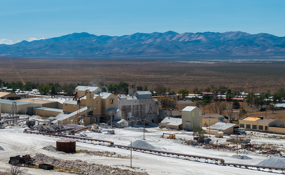 A view of the Bonneville Salt Flats, Utah, with mining equipment and buildings