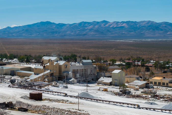 A view of the Bonneville Salt Flats, Utah, with mining equipment and buildings