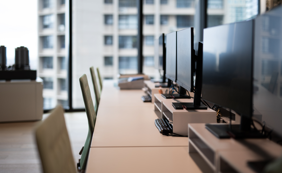 Office computers during the daytime, without employees.