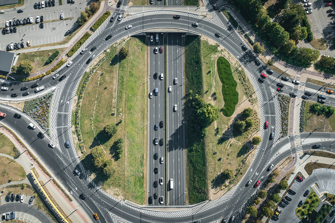 An aerial view of vehicles navigating a busy traffic circle