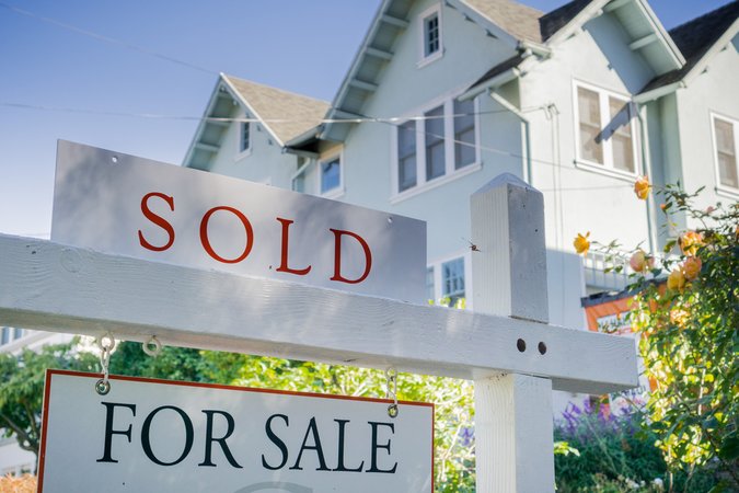 For sale sign sold house